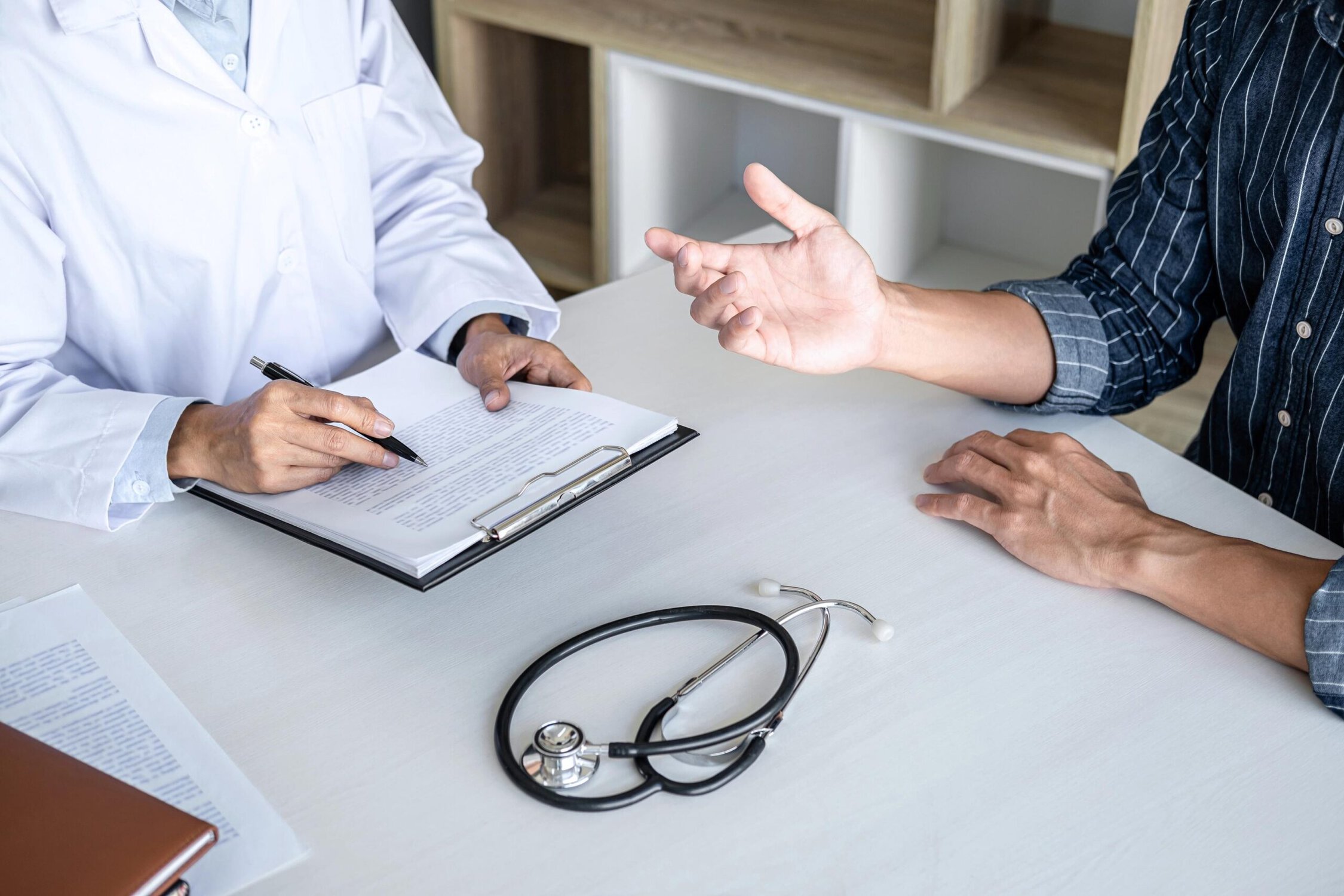 Doctor and patient discussing treatment options at Inner Voyage Recovery Center.