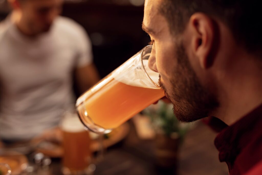 A man dealing with the signs and symptoms of being a high functioning alcoholic.