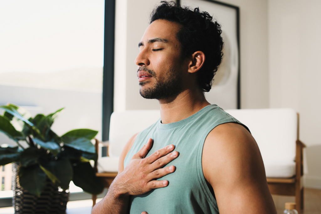 Man practicing mindfulness and meditation for holistic healing at Inner Voyage Recovery Center.