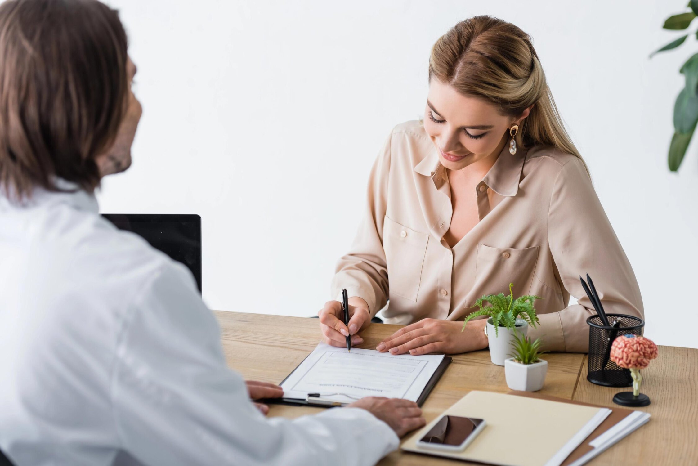 Counselor and client in a therapy session at Inner Voyage Recovery Center.