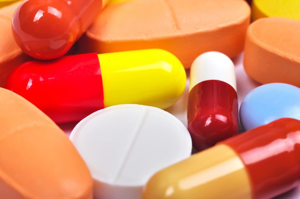 Assorted prescription pills and capsules for medication management.